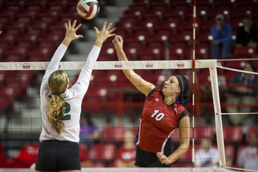 Junior+outside+hitter+Haley+Bodway+goes+up+for+a+spike+against+a+North+Texas+defender+during+WKUs+match+on+Sunday.+Bodway+racked+up+10+kills+as+WKU+defeated+UNT+in+four+sets.+Brandon+Carter%2FHERALD