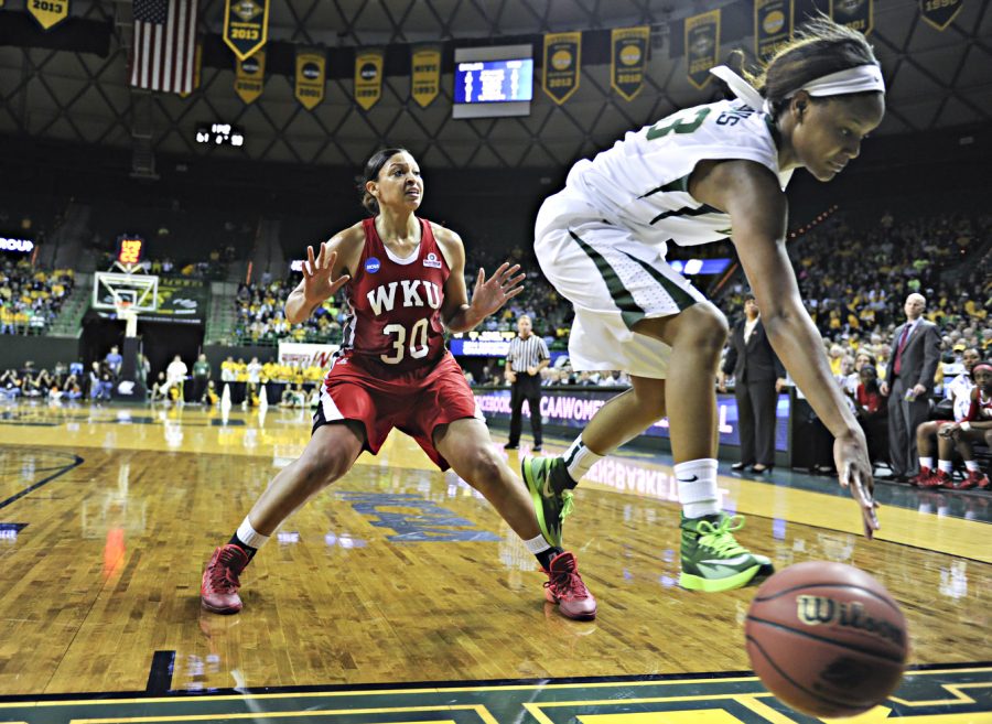 Baylor freshman forward Nina Davis tries to save the ball from going out of bounds while WKU junior forward Chastity Gooch steps back during the first round of the 2014 NCAA Divison I Womens Basketball Championship at the Ferrell Center in Waco, Texas on Saturday March 22, 2014. (Jeff Brown/HERALD)
