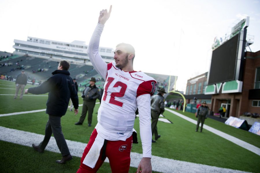 Redshirt senior quarterback Brandon Doughty signals upward following WKUs 67-66 overtime win over No. 19 Marshall in Huntington, West Virginia. Doughty threw for 491 yards and eight touchdowns to five different receivers in the upset victory. The Hilltoppers win spoiled the Thundering Herds bid for an undefeated season. Nick Wagner/HERALD