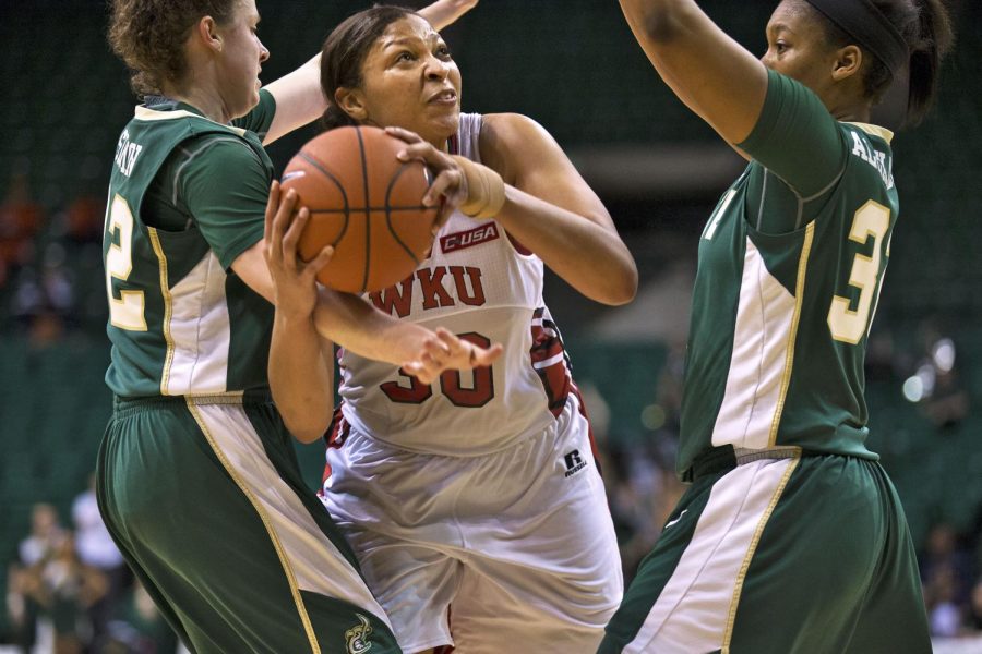 WKUs senior forward Chastity Gooch (30) gets penned in and draws a foul from Charlottes guard Hillary Sigmon (22) during the Hilltoppers 70-67 win over Charlotte in the second round of the Conference USA tournament Thursday, March 12, 2015, at Bartow Arena in Birmingham, Ala. Gooch notched 19 points in the game. The Lady Toppers advance to take on Old Dominion in the semifinal game at 12:30 p.m. Friday, March 13, 2015. Mike Clark/HERALD