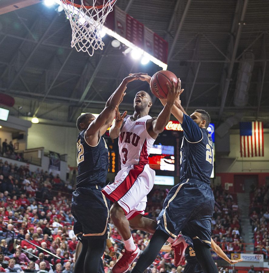 WKU senior guard, Trency Jackson, penetrates a block to complete a two-point layup against Florida International University, at E.A. Diddle Arena, Saturday Feb. 28, 2015. Jackson scored 17 points during the last home game of the season. The Hilltoppers won 77-61. Jeff Brown/HERALD