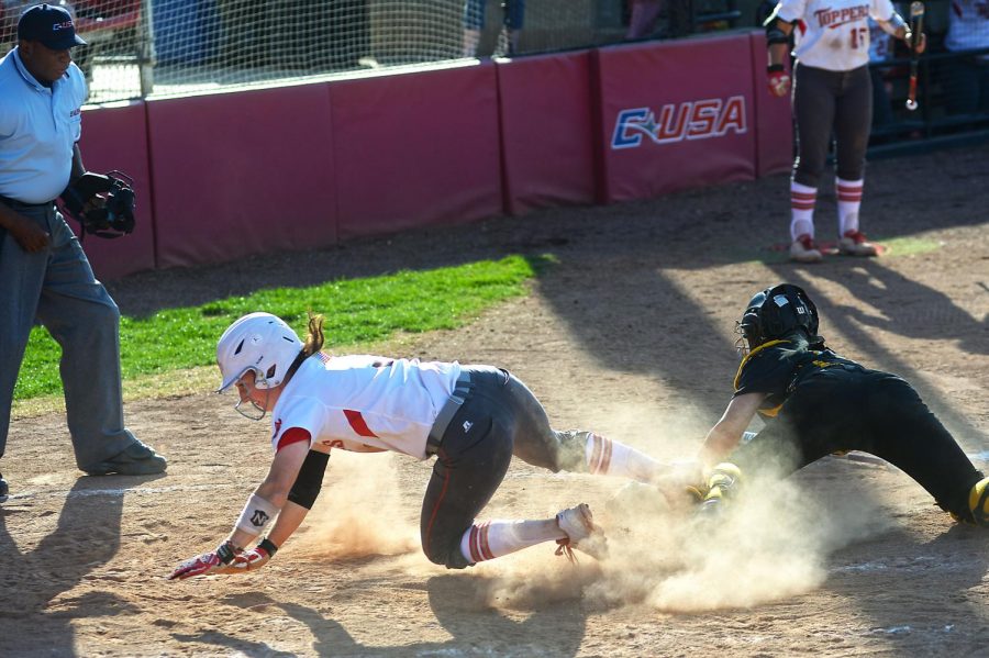 WKU junior Brook Holloway dodges the tag to score a run against USM. This was the third of six runs scored by the lady Hilltoppers during the second game of the double header played on April 11. The game ended with the lady Eagles being shut out 6-0. SPECIAL TO HERALD/ Andrew Livesay