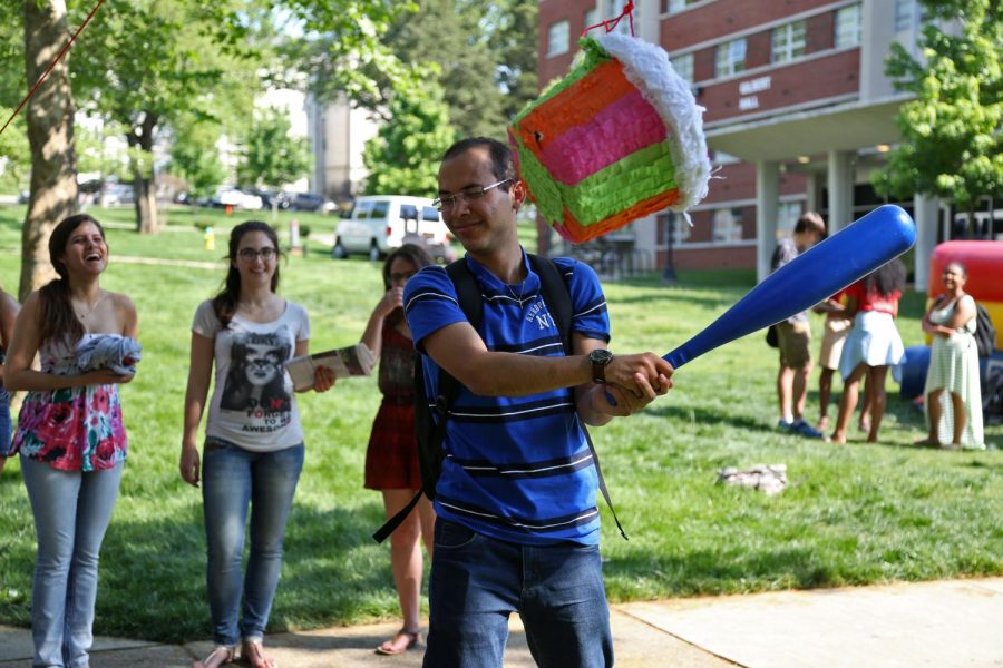 Sophomore Felipe Silva an international student from Brazil attempts to knock down the pinata at Valleypalooza Cinco De Mayo edition on Tuesday May 5, 2015. ASHLEY COOPER/HERALD