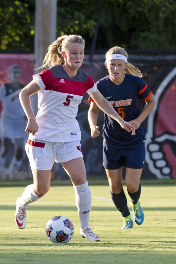 WKUs forward Lauren Moats (5) brings the ball down the field while evading University of Tennessee-Martins Zara Musker (5) during the Lady Toppers 3-1 win over UTM in the season opener Friday, Aug. 21, 2015, at the WKU Soccer Complex in Bowling Green, Ky.