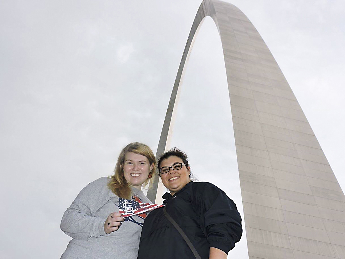 WKU+students+Laura+Coomer%2C+left%2C+and+Megan+Dunn+pose+for+a+picture+under+the+St.+Louis+Arch+during+the+2014+Alternative+Fall+Break.+Photo+submitted+by+Megan+Dunn