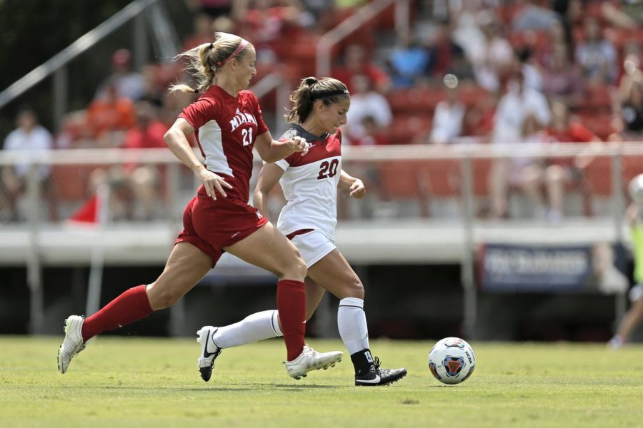 WKUs forward Hannah Cady (20) drives towards the goal as Miami Universities defender Dana Miller (21) tries to stop her during WKUs 0-4 loss to Miami on Sunday Aug. 23, 2015 at the WKU Soccer Complex is Bowling Green, Ky.