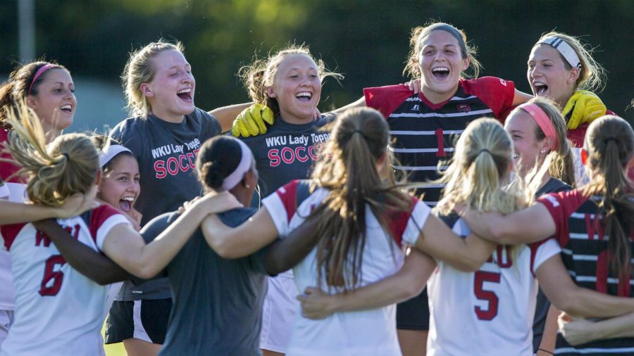 The WKU soccer team cheers before the start of the Lady Toppers 3-1 win over University of Tennessee - Martin in the season opener Friday, Aug. 21, 2015, at the WKU Soccer Complex in Bowling Green, Ky.