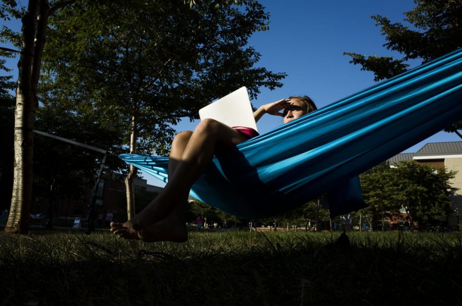 Bardstown sophomore Madlyn Beasley, a communications and Spanish major, enjoys the afternoon sun in her hammock outside of Minton Hall in August. Brittany Greeson/Special To The Herald