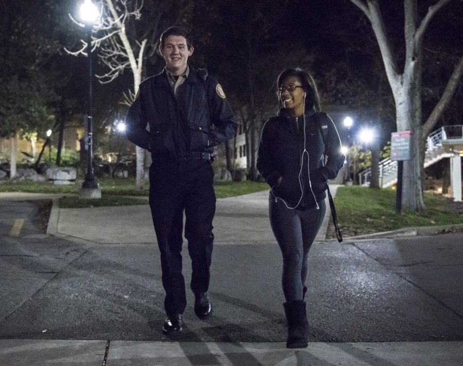 WKU Police Explorer Dylan Givens, a junior from Benton, escorts freshman Kayla White to her dorm Sunday night. The Explorers, who work with the campus police, patrol the campus at night while keeping an eye out for illegal activity, making sure residence hall doors stay properly locked and walking with students who desire an extra sense of security after dark.