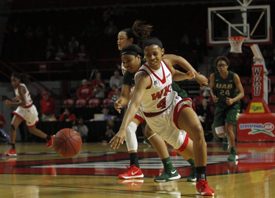 Freshman forward Dee Givens (4) steals the ball during the first half of the WKU vs. University of Alabama, Birmingham game on Saturday, Feb. 27 at Diddle Arena. Ebony Cox/HERALD