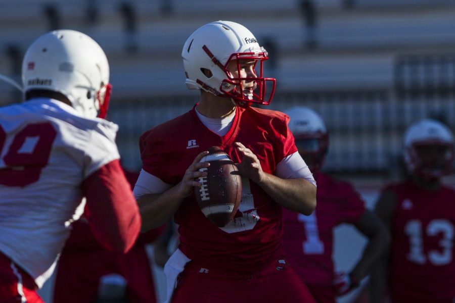 WKU quarterback Nelson Fishback, center, looks for an open receiver during a WKU football team practices on Tuesday April 12, 2016 at L.T. Smith Stadium in Bowling Green, Ky. Shaban Athuman/HERALD