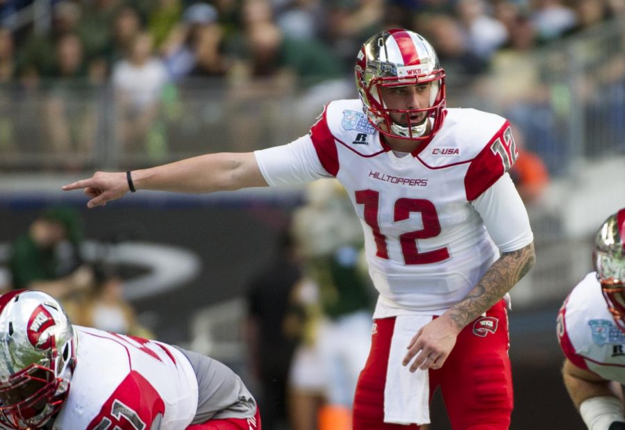 December 21, 2015: Western Kentucky quarterback Brandon Doughty (12) directs a teammate during the first half of the Miami Beach Bowl against South Florida at Marlins Park in Miami, Florida, on Monday, Dec. 21, 2015. Nick Wagner/HERALD
