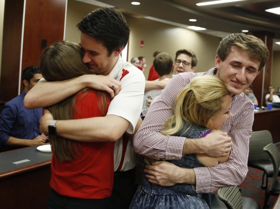 Student President Jay Todd Richey, left hugs Administrative Vice President Hannah Neeper, and Executive Vice President Kate Hart hugs Colton Hushell after the SGA results announcement on April 20, 2016 in Downing Student Union, Bowling Green, Kentucky. Michael Noble Jr./HERALD