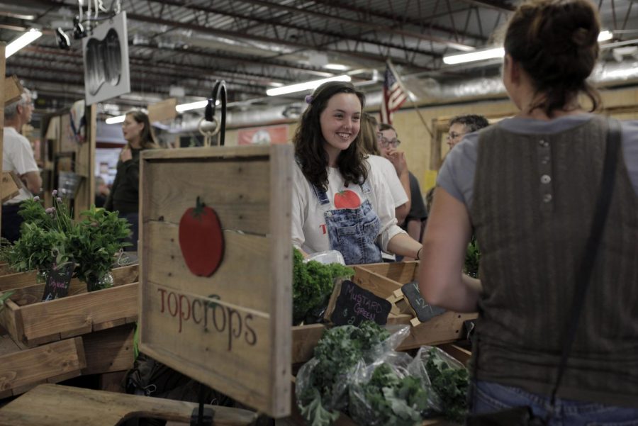 Lawrenceburg junior Alexis Corbin works for the local organization Top Crops at the local farmers market Saturday, April 30. Top Crops currently sells a variety of vegetables and plans to sell blueberries and strawberries in the future; they will be growing pumpkins in the fall. Lex Selig/HERALD