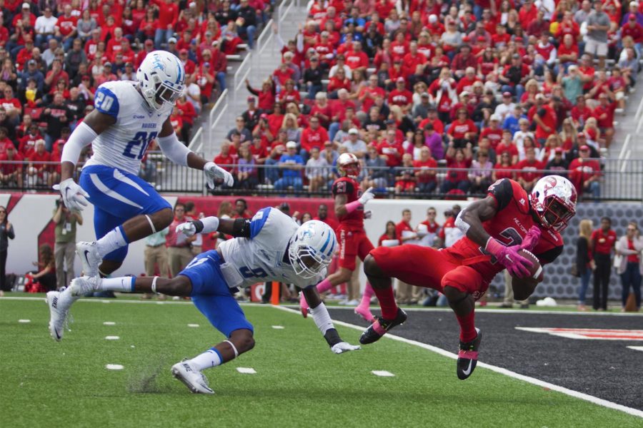 WKUs wide receiver Taywan Taylor (2) dives into the end zone to score a touchdown during the WKU Hilltoppers 58-28 win against the Middle Tennessee State University Blue Raiders football game on Saturday at L.T. Smith Stadium.