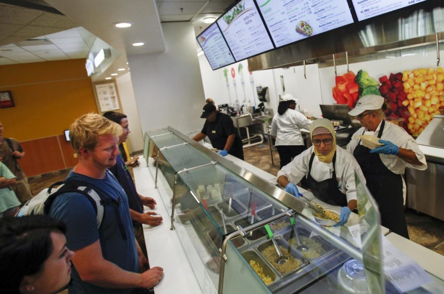 Freshens workers prepare food on Tuesday, Aug. 23, in the Tower Food Court. Freshens opened for the first time on Monday and replaces JuiceBlendz and Burger Studio. Ebony Cox/HERALD