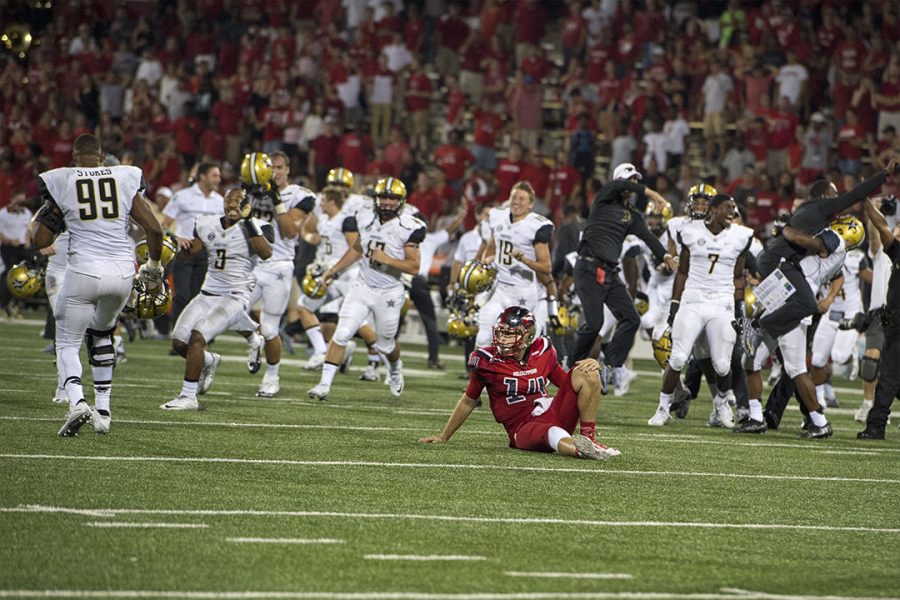 Vanderbilt celebrates in overtime as Western Kentucky University quarterback Mike White (14) is in a daze after the game Saturday, Sept. 24, 2016, at Houchens-Smith Stadium in Bowling Green, Kentucky. WKU lost 31-30 in overtime against Vanderbilt. Vanderbilt broke WKUs 11 game home win streak. This is WKU first lost at home since Oct. 4, 2014. (Jeff Brown/Herald)