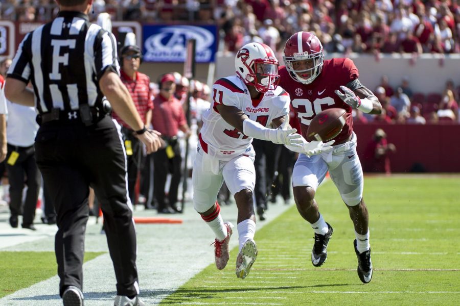 Redshirt freshman wide receiver Lucky Jackson (11) attempts to catch a pass under coverage from Alabamas defensive back Marlon Humphrey (26) during WKUs 10-38 loss on Saturday, Sept. 10, 2016, at Bryant–Denny Stadium in Tuscaloosa, Alabama.