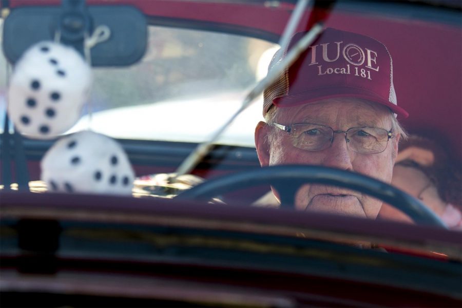 Roger Murray, a Catlettsburg local, sits in his restored 1936 Ford Coupe Deluxe before taking part in the Catlettsburg Laber Day Parade early on Monday, Sept. 5 in Catlettsburg. Murray said he enjoys watching children scramble for the candy he tosses onto the sidewalk.