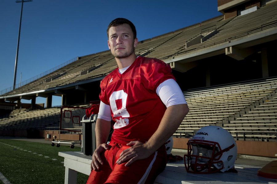 Redshirt senior quarterback Nelson Fishback (9) sits for a portrait after the football team practices on Tuesday, April 12 at Smith Stadium. Fishback was expected to be the starting quarterback until he tore a muscle during a practice.