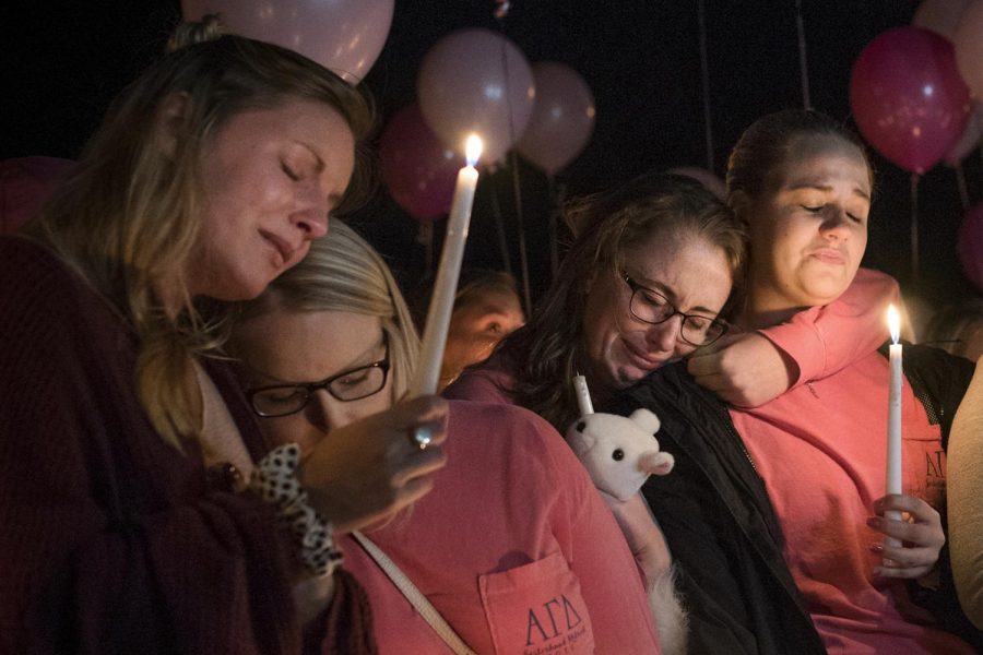 From left to right, Hayley Hoback, Izzy Rager, Morgan Goetz and Rachel Shipp lean on one another at a vigil to memorialize their Alpha Gamma Delta sister, Stephanie Campbell, on Wednesday, Sept. 28 at the AGD sorority house. Campbell passed away Sunday, Sept. 25 as a result of a single-car accident on the Western Kentucky Parkway. She has tattooed on her foot You can breathe, remembered Hayley Hoback at the vigil. And thats what I can say to her. You can breathe now. Shes in a better place now. Gabriel Scarlett/HERALD