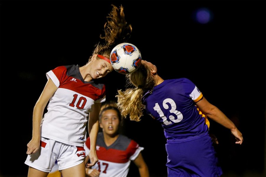 Sophomore midfielder Sarah Gotham (10) and Louisiana State senior defender Megan Lee (13) go up to head a ball during the Lady Toppers 1-0 loss to the Tigers Thursday, Sept. 8 at WKU Soccer Complex. Matt Lunsford/HERALD