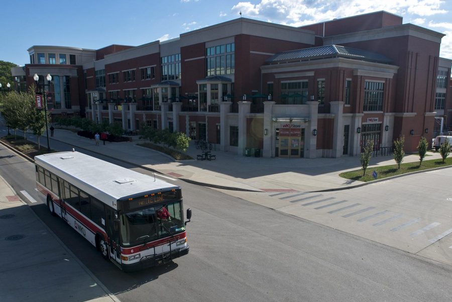 A campus bus leaves the bus stop in front of the Downing Student Union on Sept. 28, 2016. A new bus route will allow students to park in the downtown parking garage and ride the bus to campus. Matt Lunsford/HERALD