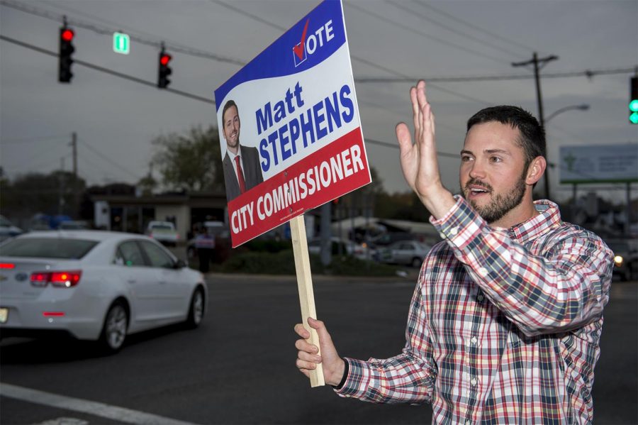 Matt Stephens, of Bowling Green, wavies to supporters in hopes to get them to vote for him at the polls for City Commissioner during the Nov. 8, 2016 election in Bowling Green, Kentucky. Its very humbling to see the all the support Ive gotten. Its really cool to wave at people, point at them, and make eye contact, Stephens said. (Jeff Brown/Herald)