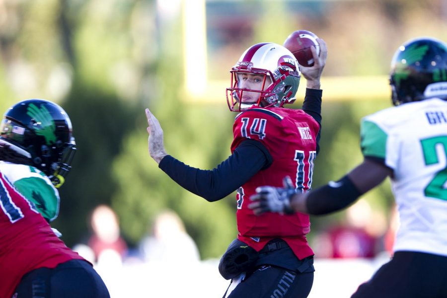 Redshirt junior quarterback Mike White (14) makes a pass during WKUs 45-7 victory over North Texas on Saturday, Nov. 12, at Smith Stadium. White passed for 316 yards and 4 touchdowns. Kathryn Ziesig/HERALD