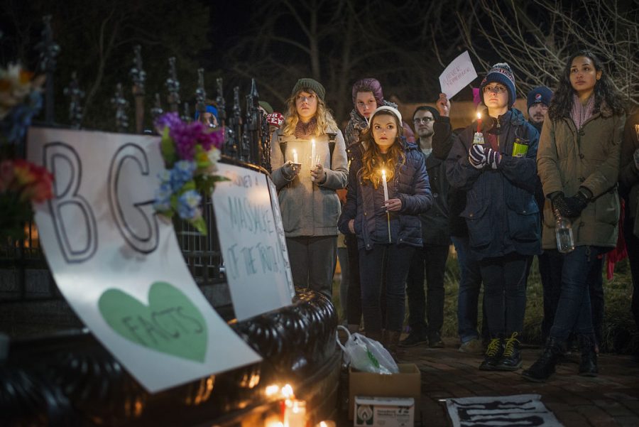 Community members hold candles at the Bowling Green Massacre Remembrance Gathering Feb. 3, 2016. Organizer Justin Swindle, 27, said it all began as a joke with friends. It somehow got super popular, Swindle said, so we tried to make it matter by collecting donations. Donations will be given to the International Center of Kentucky.