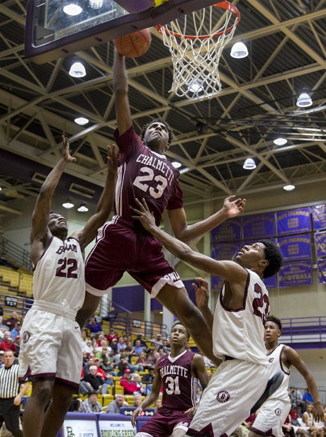 Chalmette High School Senior Mitchell Robinson (23) attempts to score a basket in a game against Ballard High School on Sat. Feb. 11, 2017 at Bowling Green High School. The 7 foot 5-star recruit signed to WKU on Nov. 15, 2016. Brendan OHern/HERALD