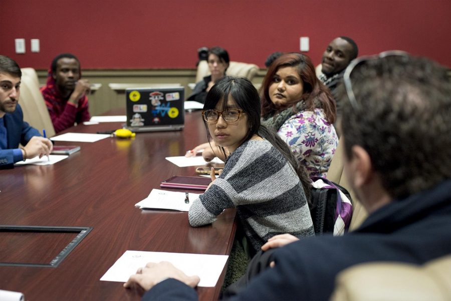 Shengjia Wan listens as T. Ryan Hall, President of ESLi, discusses potential ideas for the upcoming event. The International Student Diplomats meet on Feb. 2, 2017 to discuss how the recent ban has affected students at Western Kentucky University. The meeting was held to organize details of an upcoming event to promote interaction between International and American students, while showing support for those who have been affected.