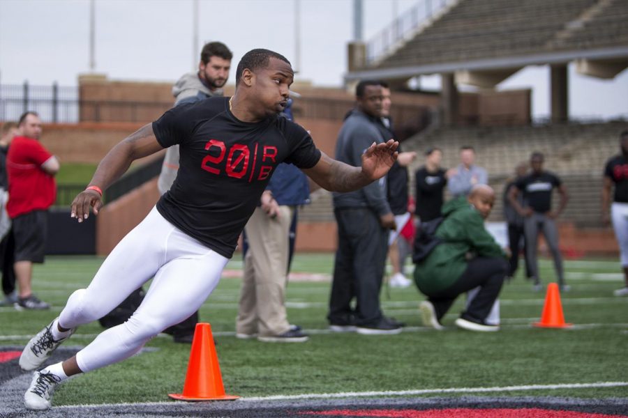 Former WKU running back Anthony Ace Wales perform drills for scouts during Pro Day on Monday at Smith Stadium.