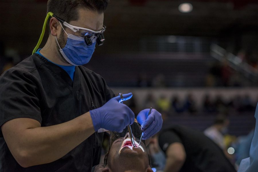 Crossville, Tenn. Native Ray Buechler, 47, gets teeth pulled during the RAM medical clinic in the gym of Cookeville High School. Tooth extractions are the most common service done by volunteers during clinics.
