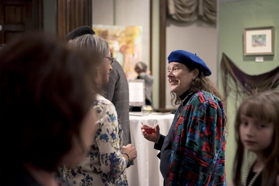 Artist Beth Hester and judge Jane-Allen McKinney share a moment during the U.S. Bank Celebration of the Arts exhibition at the Kentucky Museum on Friday March 3, 2017.