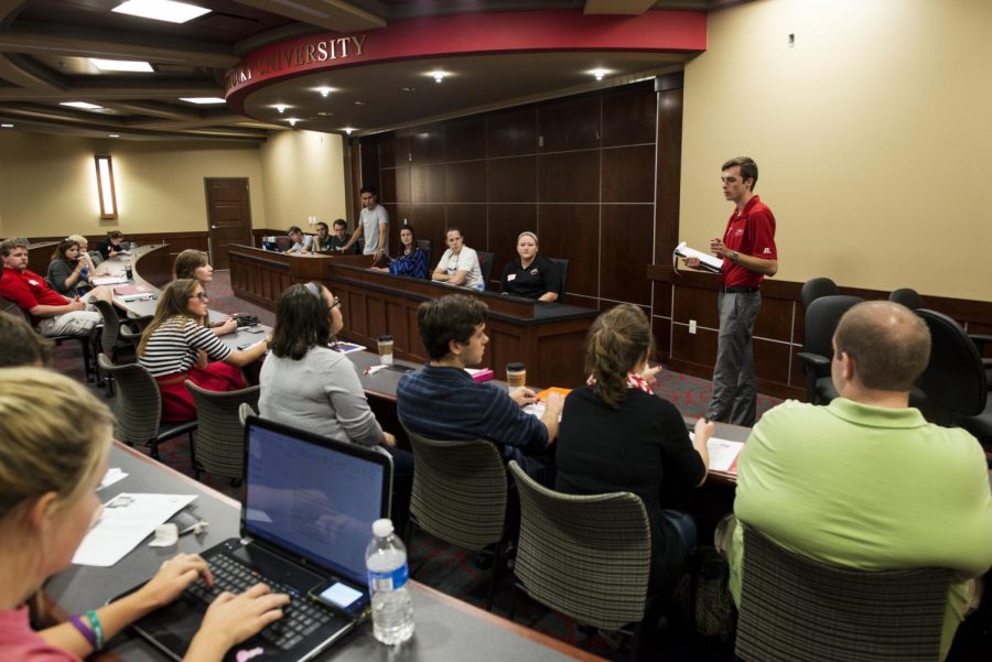 Executive Vice President Nolan Miles addresses attendees at the Student Government Association meeting in the newly constructed SGA senate chambers in the Downing Student Union on on Sept. 23, 2014. Prior to this year, SGA meetings were held in Cravens Library. William Kolb/HERALD