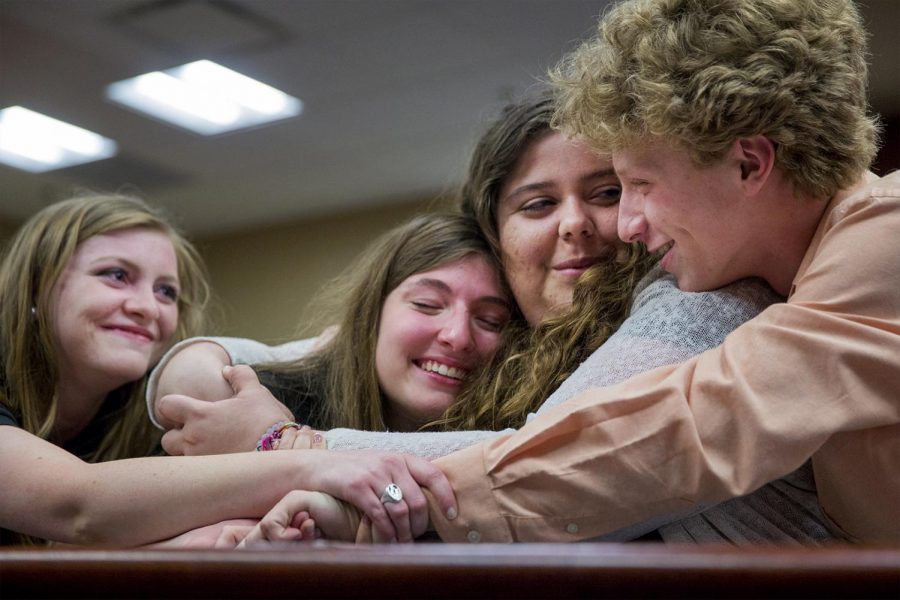 From left to right) Louisville sophomore Savannah Molyneaux, Louisville sophomore Andi Dahmer, La Grange sophomore Kara Lowry and Buckner freshman Conner Hounshell gather for a hug after hearing the election results at midnight Wednesday in the SGA Chamber. Dahmer was elected student body president while Molyneaux was elected executive vice president and Lowry was elected administrative vice president.   