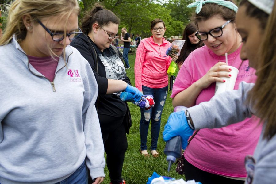 Students make tie-dye shirts during Hope on the Hill, a mental illness awareness program, at the DSU Courtyard on Monday April 1, 2017. The program informed students what mental illness is and how it can affect people by having fun events such as making tie dye t-shirts and serving rainbow-colored ice cream floats. The goal of the program was to break the stigma associated with mental illness.
