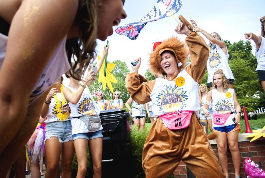 Caitlin Brock and other members of the Phi Mu sorority wait for the arrival of their new sisters during Bid Day at Centennial Mall on Sunday, Aug. 20. Brock says she looks forward to getting new members into the family. They all bring their own essence.