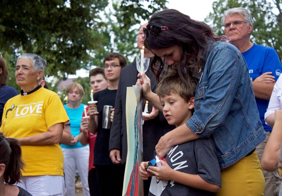 Megan Gammons comforts her son after the Vigil on Sunday night. You make your president to be a role model for your children, however, we have a president who cant even call out violence and nazism when its blankly obvious. Gammons commented.