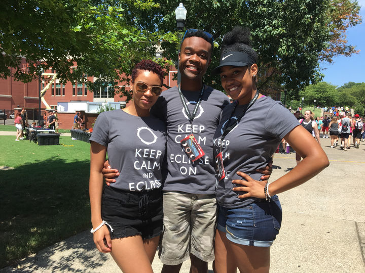 WKU students Shante Parker (left), Nyill Brooks (center) and Shante Smith pose in matching t-shirts during the eclipse Monday.
