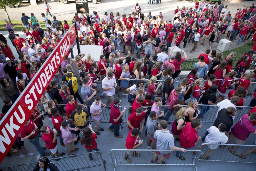 WKU students rush to Houchens Stadium after tailgating ended, Saturday, Sept. 2, 2017. Tailgating was once held in the Valley but has since been moved to the bottom of the hill due to the construction of Hilltopper Hall.