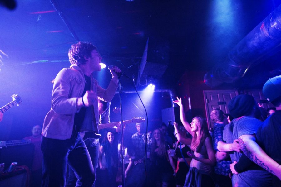 Lead singer Matthew Shultz (left) performs in front of a packed crowd with his band Cage the Elephant at Rockys Thursday, Jan. 30, 2014, in Bowling Green, Ky.(Mike Clark/HERALD)