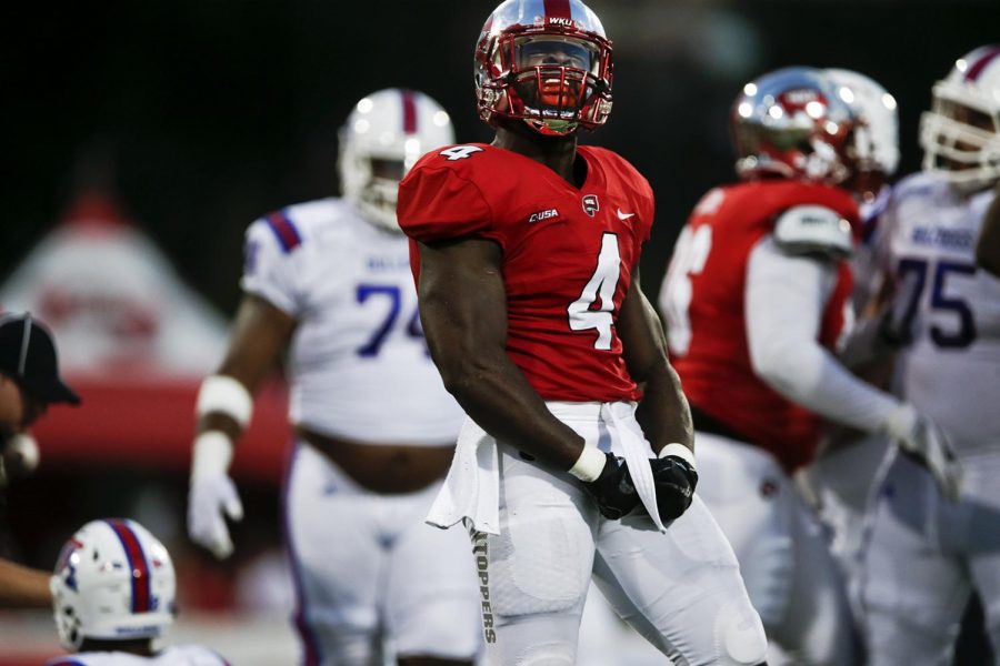 Western Kentucky University linebacker Joel Iyiegbuniwe (4) celebrates after sacking the Louisiana Tech quarterback during the Hilltoppers 22-23 loss to Louisiana Tech University last Saturday September 16, 2017 at L.T. Smith Stadium.