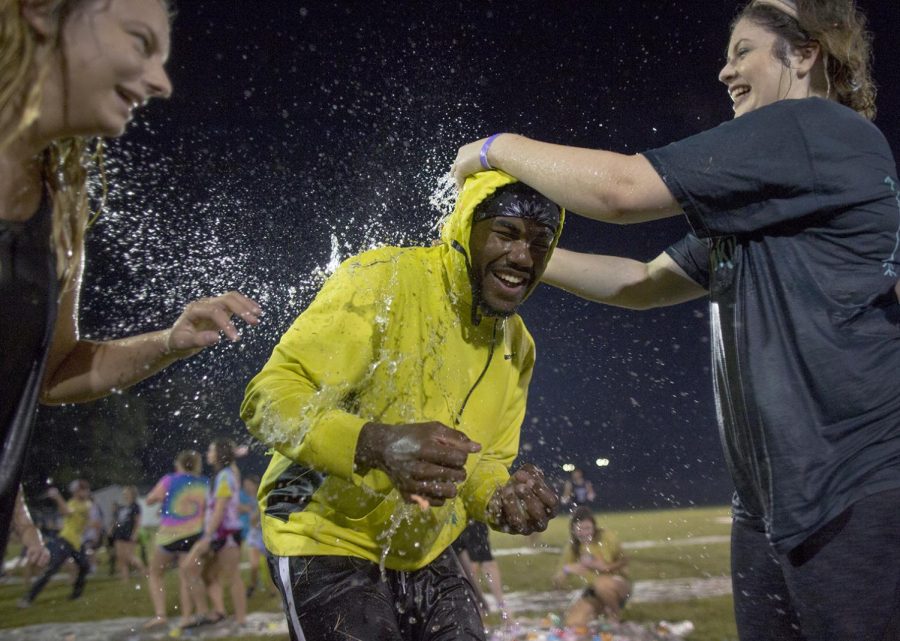 Sophomore Juan Dozier flinches as water balloons are broken over his head at the WKU Intramural Fields on Friday, September 15, 2017. Fiji fraternity filled up 50,000 water balloons and had a water balloon fight to raise money for relief aid for those affected by Hurricane Harvey.