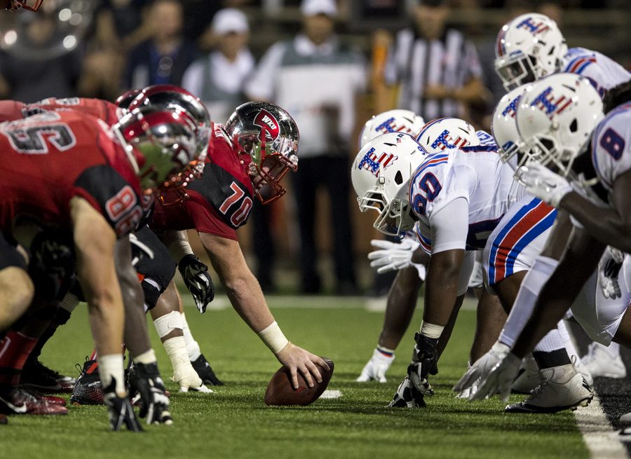 The offensive line prepares for former WKU center Max Halpin (70) to snap the ball during WKUs game against Louisiana Tech on Sept. 10, 2015, at Houchens- Smith Stadium. 