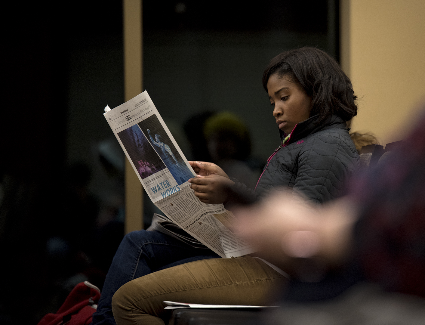 Jocelyn Porter reads a copy of the Herald before Narrations, a storytelling event presented by the College Heights Herald, begins. Narrations was held on the top floor of Downing Student Union on Nov. 14 at 7pm.