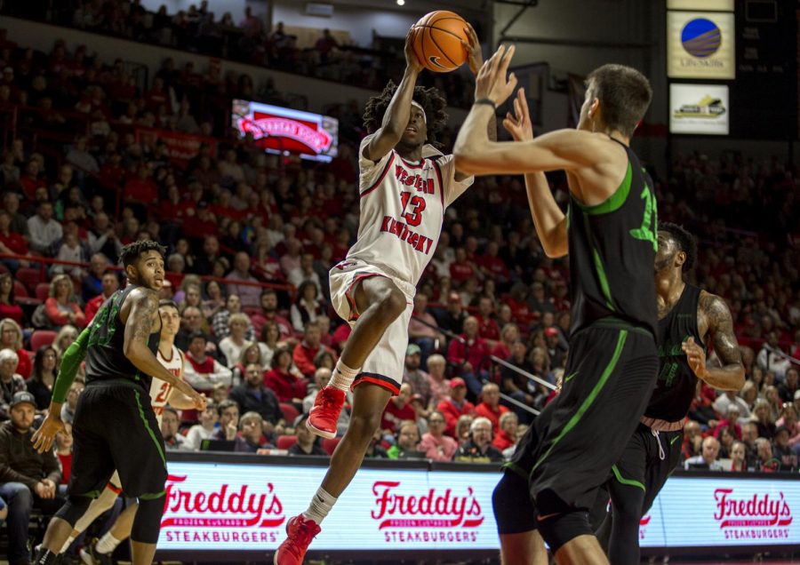 Taveion+Hollingsworth%2C+WKU+guard%2C+goes+up+for+a+shot+against+Marshall+University.+WKU+won+with+a+final+score+of+85+to+74.