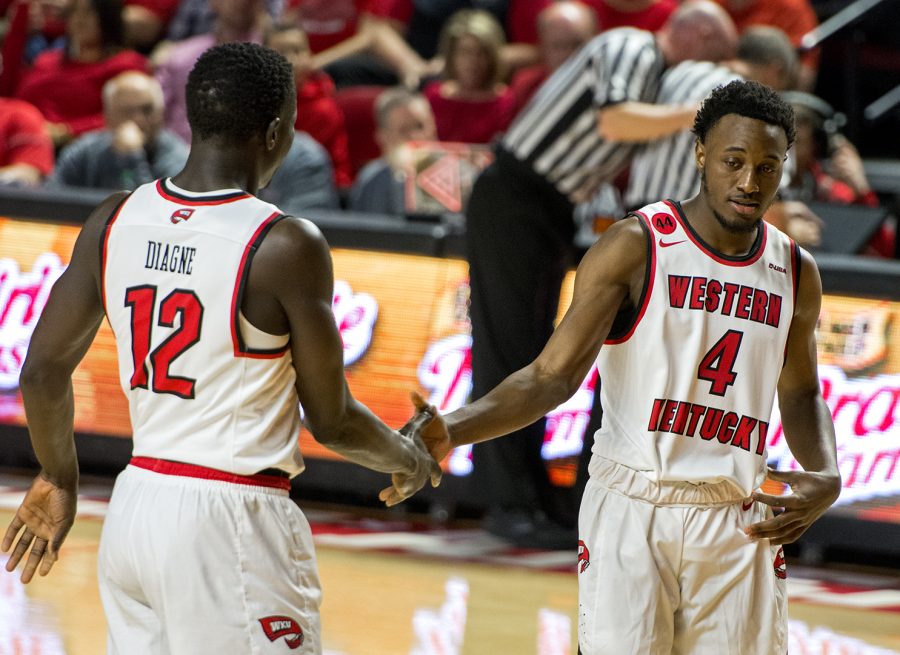 WKU+forward+Moustapha+Diagne+%2812%29+gives+good+luck+to+WKU+guard+Josh+Anderson+%284%29+at+the+free+throw+line+during+the+game+against+Marshall+on+Saturday%2C+Jan.+27+in+E.A.+Diddle+Arena.+In+Andersons+10+minutes+of+playing+time%2C+he+totaled+four+points+including+a+dunk+in+the+first+half.+The+Hilltoppers+won+the+game+85-74.