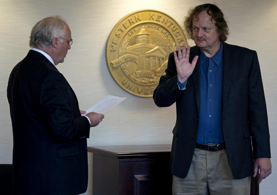 Mathematics professor Claus Ernst is sworn in as faculty regent at the Board of Regents meeting Friday, January 26 in Jody Richards Hall. Ernst succeeded Barbara Burch, provost emerita, after a series of votes that prolonged the naming of newest faculty regent..